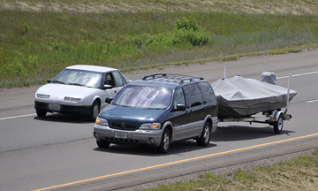 Minivan Towing a Boat